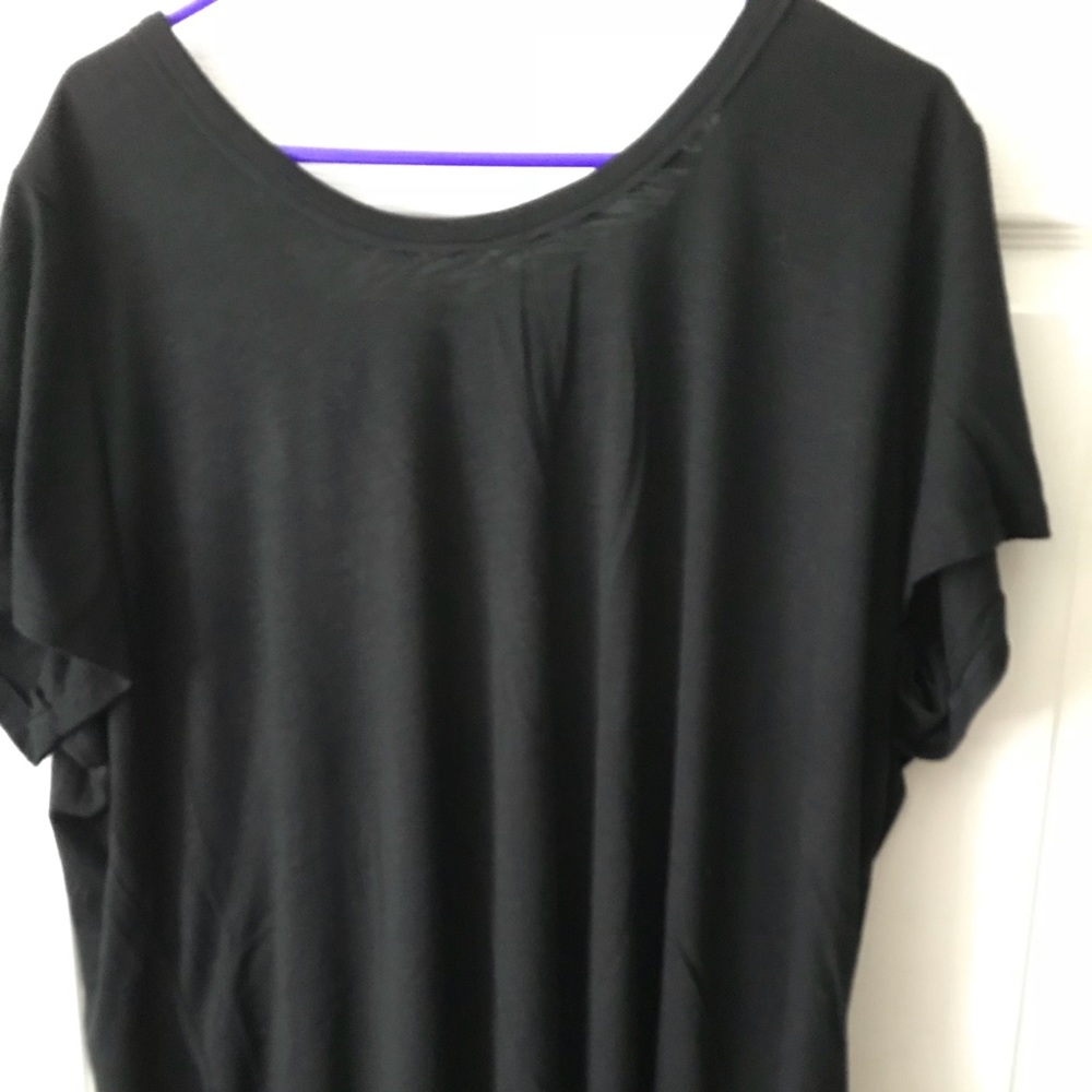 Black short sleeve top with embroidered tie back